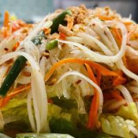 Green Papaya Salad  · Shredded green papaya with green beans, tomatoes, carrots and roasted peanuts in spicy lime ...