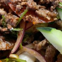 Yum Nuer · Slice grilled beef made with toasted sticky rice powder, red onion, cucumber, green onions, ...