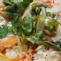 Tom Kha · Coconut soup with lemongrass, mushrooms, tomato, onions, cilantro, kaffir lime leaves and a ...