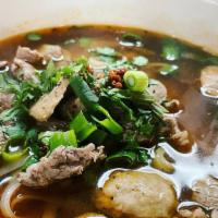 Thai Boat Noodle · Small rice noodles with sliced beef, beef ball, onion, green onion and bean sprout in a spec...