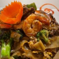 Pad See Ew · Flat big rice noodle stir fried with, egg, broccoli, cabbage and carrot in black soy sauce.