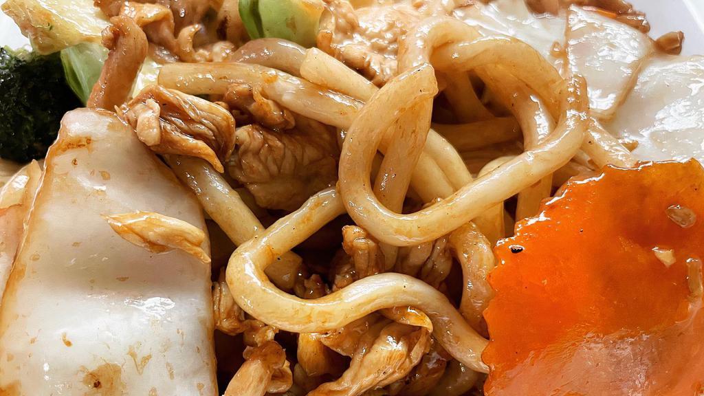 Sp10. Stir Fried Udon Yaki · Japanese udon noodles stir fried with onions, broccoli, cabbage and carrots.