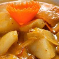 C4 Mussamun Curry · Simmered in red curry with coconut milk, potato, carrot, onion, tomato and peanuts, served w...