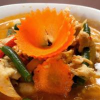 C6 Panang Curry · Simmered in red curry spices, peanut sauce, coconut milk, bell peppers and green bean, serve...