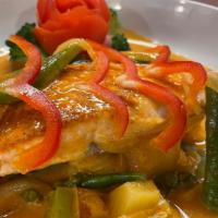 Chu Chi Salmon In Pineapple Curry · Grilled salmon in red curry pineapple sauce with green bean, tomato, bell pepper and kaffir ...