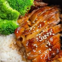 Chicken Teriyaki · Grilled marinated chicken with teriyaki sauce, served with rice and steam broccoli.