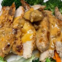 Lemongrass Chicken · Grilled marinated chicken with fresh lemongrass, steamed broccoli and carrot topped with pea...