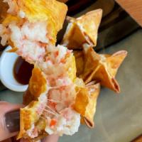 Crab Cheese Wonton (5) · Deep-fried cheese and imitation crab meat wrapped in wonton skin served with house sauce.