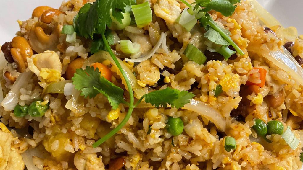 Pineapple Fried Rice · Egg, pineapple, onion, raisin, pea and carrot, cashew nut and curry powder.