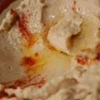 Hummus · Served with naan. A thick paste made from ground garbanzo beans, tahini sauce, olive oil, le...