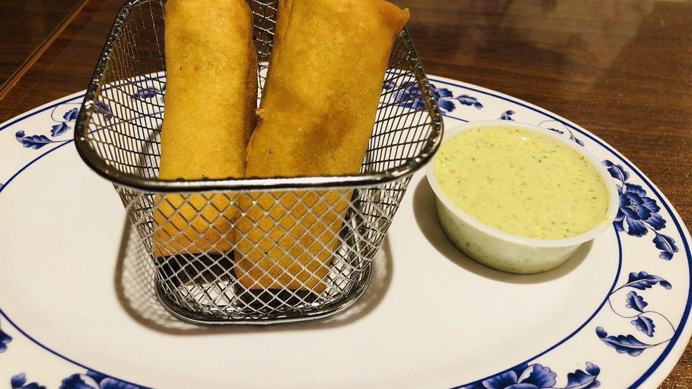 Spring Rolls · Rice paper filled with minced vegetables rolled into a cylinder and fried.