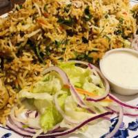 Chicken Biryani · Basmati rice with boneless chicken cooked in herbs, spices and seasonings.