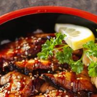 Unagi Don · Bowl of sushi rice, sesame seeds, BBQ unagi 8 pieces, tamago 1 piece, eel sauce