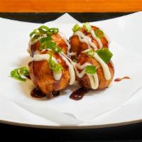 Takoyaki · 4 pieces. Octopus dumplings 4 pieces, katsuobushi, tonkatsu sauce, mayo