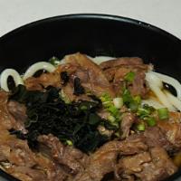 Beef Karubi Udon · Udon noodle, beef karubi yakiniku 4 pieces, green onion, sesame seeds, soy udon soup