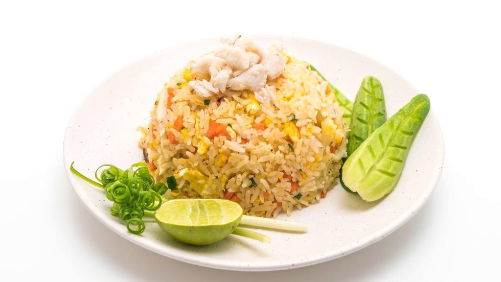 Crab Fried Rice · Sea fresh crab meat fried rice with onions, tomatoes, carrots, and egg.