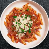 Spicy Penne With Sausage · Penne pasta with homemade pork sausage, sauteed onions, a touch of chili flakes, in a tomato...