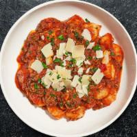 Gnocchi Bolognese · Gnocchi topped with home made meat sauce, Parmesan, and fresh Italian Parsley