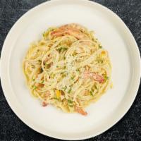 Linguini Di Mare · Linguine with sautéed prawns, mushrooms, diced tomatoes, fresh basil, tossed in a light crea...
