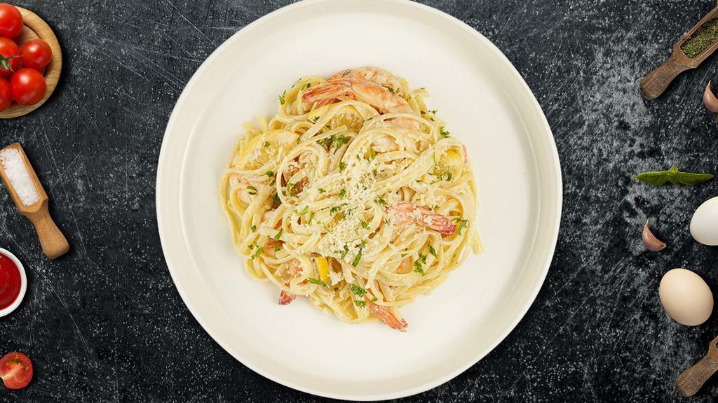 Linguini Di Mare · Linguine with sautéed prawns, mushrooms, diced tomatoes, fresh basil, tossed in a light creamy lemon sauce, topped with Parmesan and fresh Italian parsley