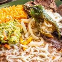 Carne Asada · Thinly sliced skirt steak grilled, served with pico de gallo, guacamole, grilled jalapeño wi...