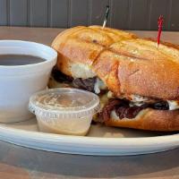 Prime Rib Dip Sandwich · Cooked tomatoes topped with mozzarella cheese. Hot submarines on a French roll with cheese i...