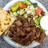 Gyro Platter · Served with seasoned jasmine rice,Greek  salad, grilled pita bread, and sauces.