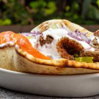 Gyro Sandwich · Broiled rotisserie seasoned gyro meat. Served on a pita with lettuce, tomato, onion, and tza...