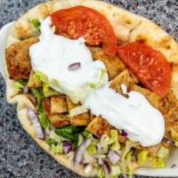 Chicken Gyro Sandwich · Rotisserie broiled chicken gyro slices served on a pita with lettuce, tomato, onion, and tza...