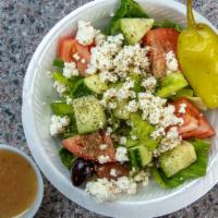 Large Greek Salad · Our Greek salad comes with lettuce, tomatoes, cucumbers, green bell peppers, red onion, pepp...