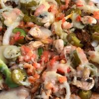 Mexican Pizza · Crispy flour tortilla topped with refried beans, ground beef, green peppers, jalapeños, onio...