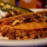 Order Of 2 Birria Tacos · 2 tacos with meat, served with onion, cilantro and consome. Carrots, limes and radishes on t...