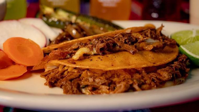 Order Of 2 Birria Tacos · 2 tacos with meat, served with onion, cilantro and consome. Carrots, limes and radishes on the side.