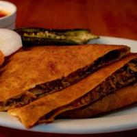 Quesadilla · Flour tortilla, cheese, onions, cilantro, birria meat. Served with consome, radishes and lim...