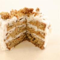 Carrot Cake · Our carrot cake is a three layer cake made the traditional way. Hints of spices, along 
with...