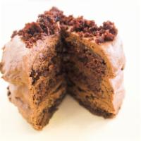 Triple Chocolate Layer Cake · Our triple chocolate layer cake begins with a brownie bottom and then layered with rich choc...