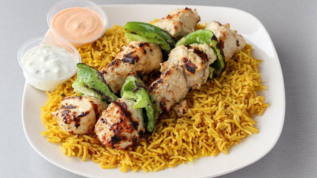 Chicken Kebob Platter · Two skewers of grilled marinated chicken. Served over a bed of rice, pick a side and sauce to complete the meal.