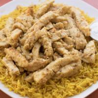 Chicken Shawarma Platter · Sliced chicken breast sauteed in shawarma spices (not spicy). Served over a bed of rice, pic...