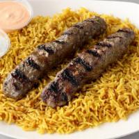 Kafta Kebob Platter · Two skewers of grilled Kafta meat (ground beef); Served over a bed of rice, pick a side and ...