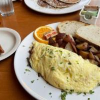 Portabella Mushroom Omelet · Portabella mushrooms sautéed with red onions in our three-egg omelet with white cheddar chee...