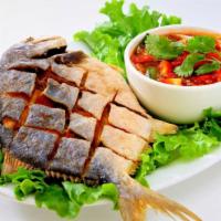 Whole Fish Of The Day · Fried or steamed (Ask your server) comes with lime chili sauce and sweet chill sauce