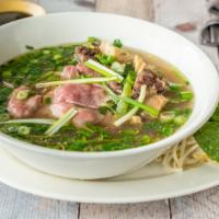 Oxtail Pho · Oxtail and steak. Rice noodle served with fresh bean sprout, basil, jalapeño, and lime. Topp...