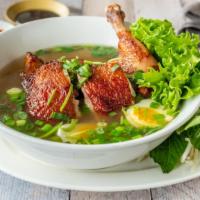 Roasted Chicken Pho · Marinated chicken leg quarter with soft-boiled egg and Chinese celery. Rice noodle served wi...