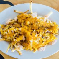West Coast Fries · Our crispy thyme fries smothered with melted cheese, grilled onions, and 1000 island sauce.