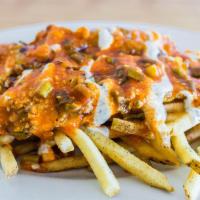 East Coast Fries · Our crispy thyme fries smothered with melted cheese, grilled onions, ranch and spicy buffalo...