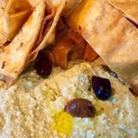 Green Hummus · Organic chickpea dip, with fire roasted poblano, served with crispy flour tortilla chips.