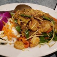 Singapore Noodles · Pan-fried small rice noodles with curry powder and vegetables.
