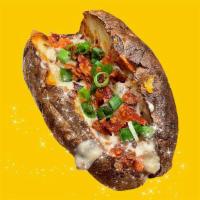 Loaded · Giant Potato cloud-fluffed inside, topped with the classic: cheddar shreds, bacon, green oni...