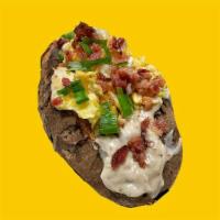Loaded Breakfast · Giant Potato cloud-fluffed inside & stuffed with gravy, cheddar cheese, bacon, chives & topp...