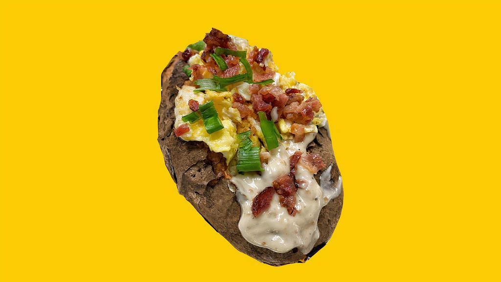 Loaded Breakfast · Giant Potato cloud-fluffed inside & stuffed with gravy, cheddar cheese, bacon, chives & topped with a fried egg.